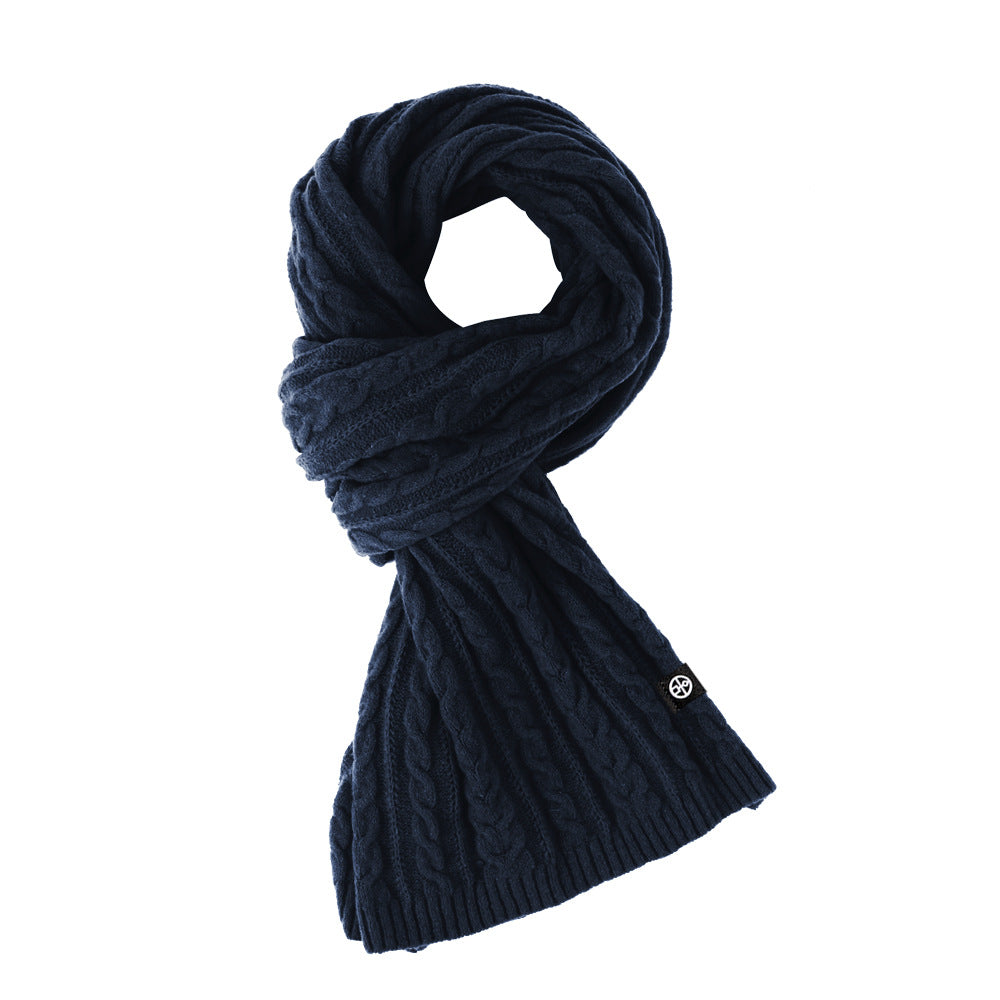 Woman wearing solid color long winter scarf outdoors