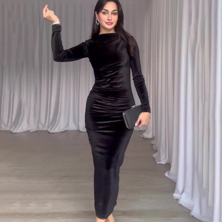 Woman wearing velvet long sleeve slim fit dress