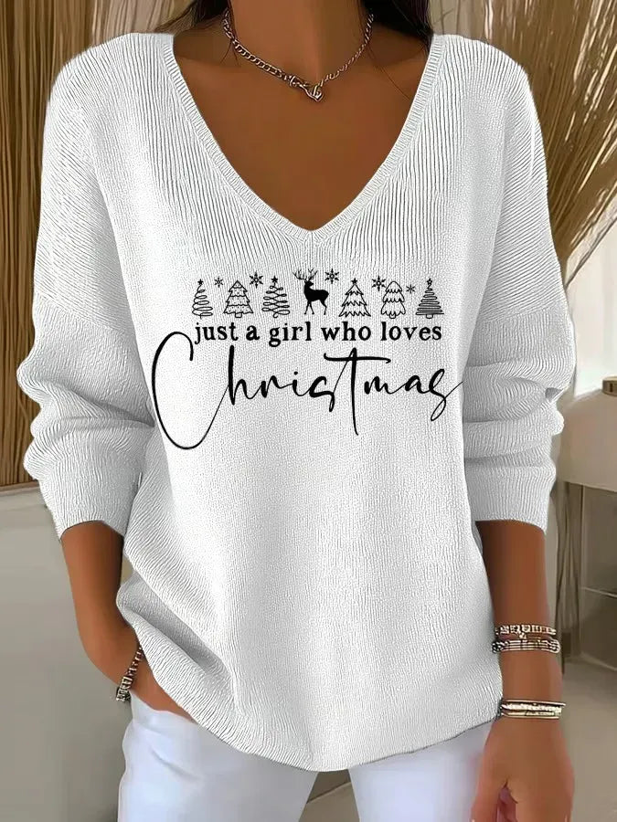 Woman wearing festive V-neck Christmas sweater with holiday print