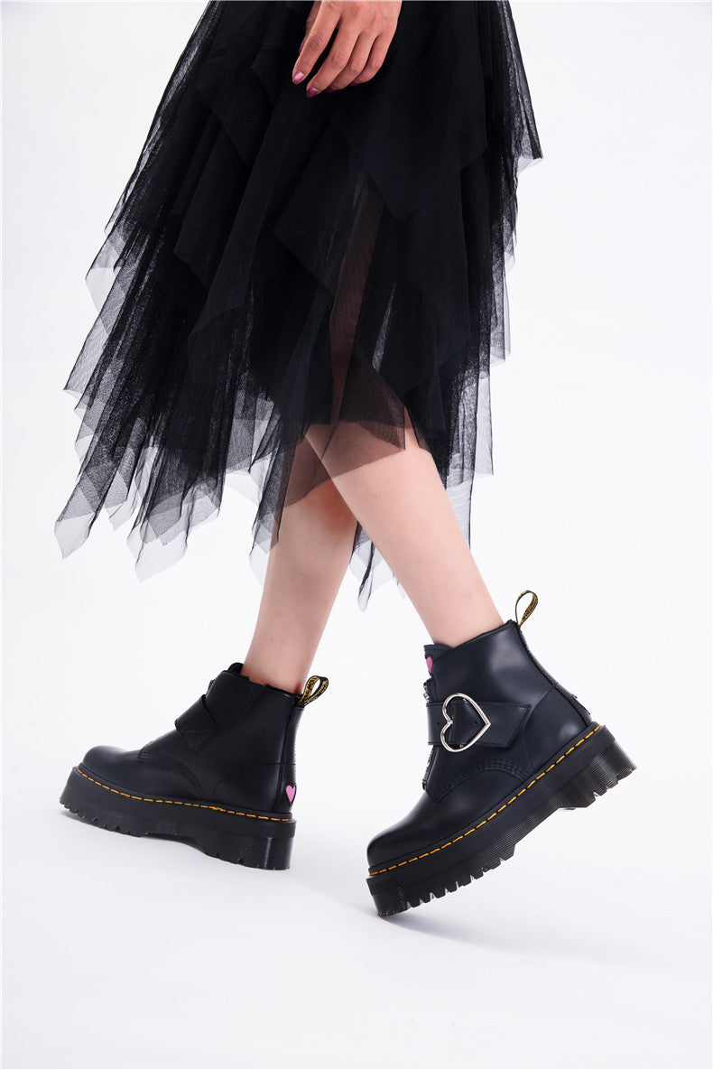 Women's black leather ankle boots with thick heel and zipper