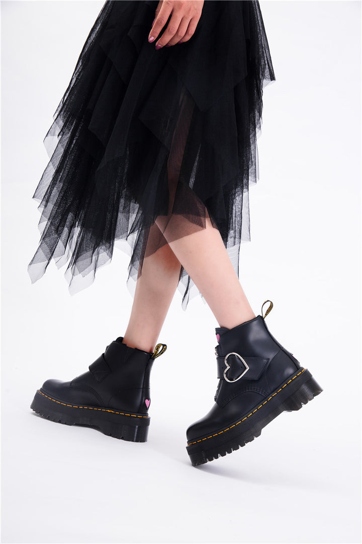 Women's black leather ankle boots with thick heel and zipper