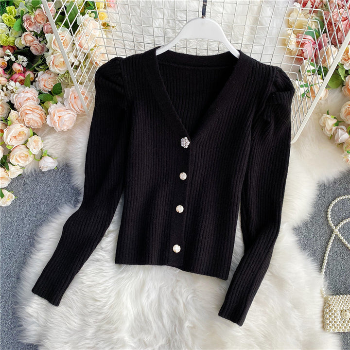Woman wearing V-neck single-breasted cardigan sweater
