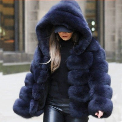 Woman wearing a faux fur winter coat with fur collar