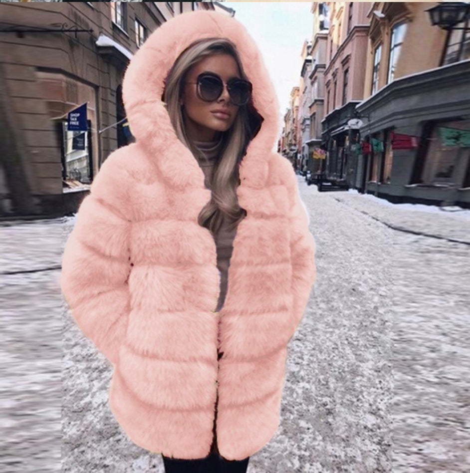 Woman wearing a faux fur winter coat with fur collar
