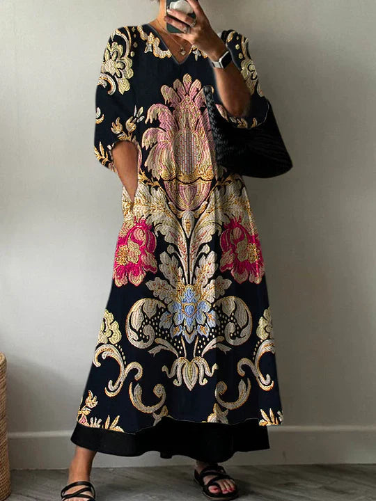 Woman wearing a flowy summer maxi dress with geometric print