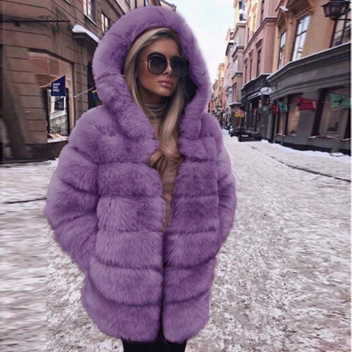 Woman wearing a faux fur winter coat with fur collar