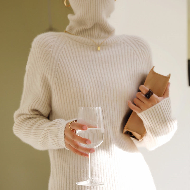 Woman wearing loose knit fall sweater in neutral color