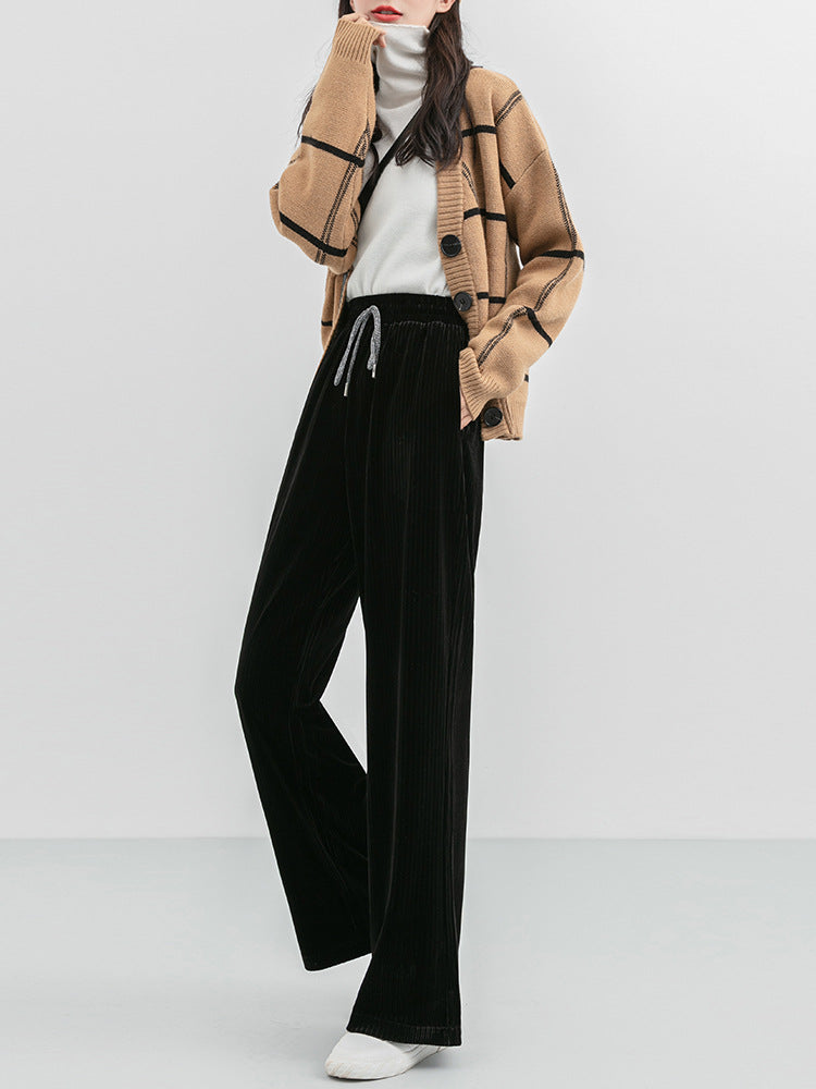 Woman wearing high waist corduroy wide leg pants