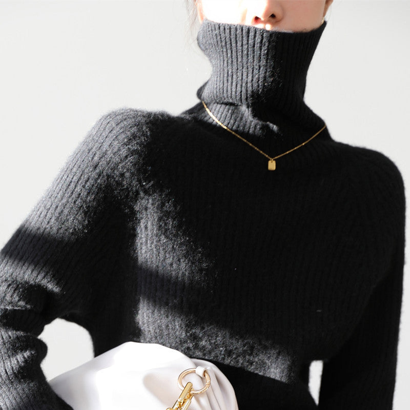 Woman wearing loose knit fall sweater in neutral color