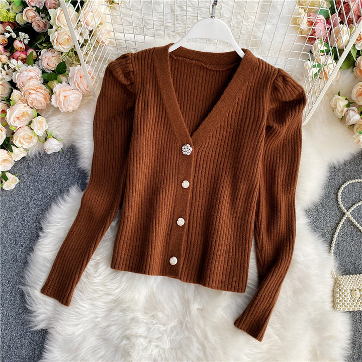 Woman wearing V-neck single-breasted cardigan sweater