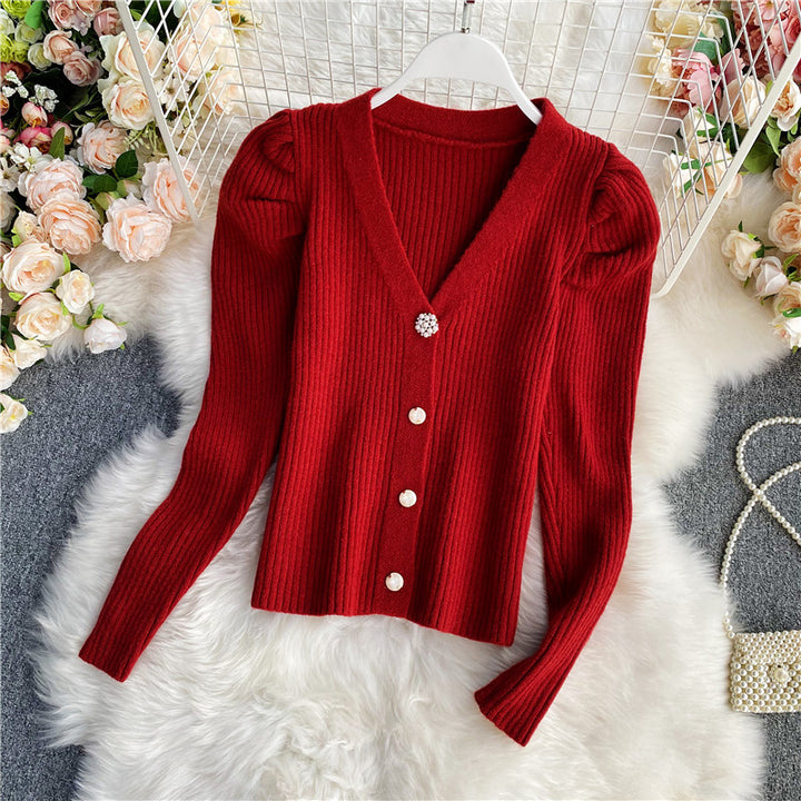 Woman wearing V-neck single-breasted cardigan sweater