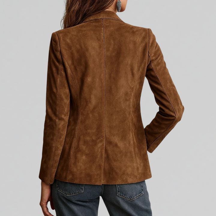 Woman wearing tailored relaxed fit blazer in cognac brown