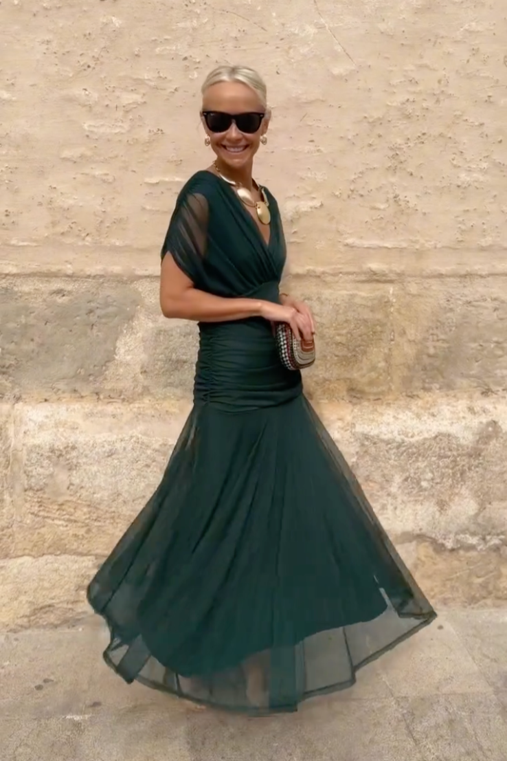Woman wearing floral print V-neck maxi dress