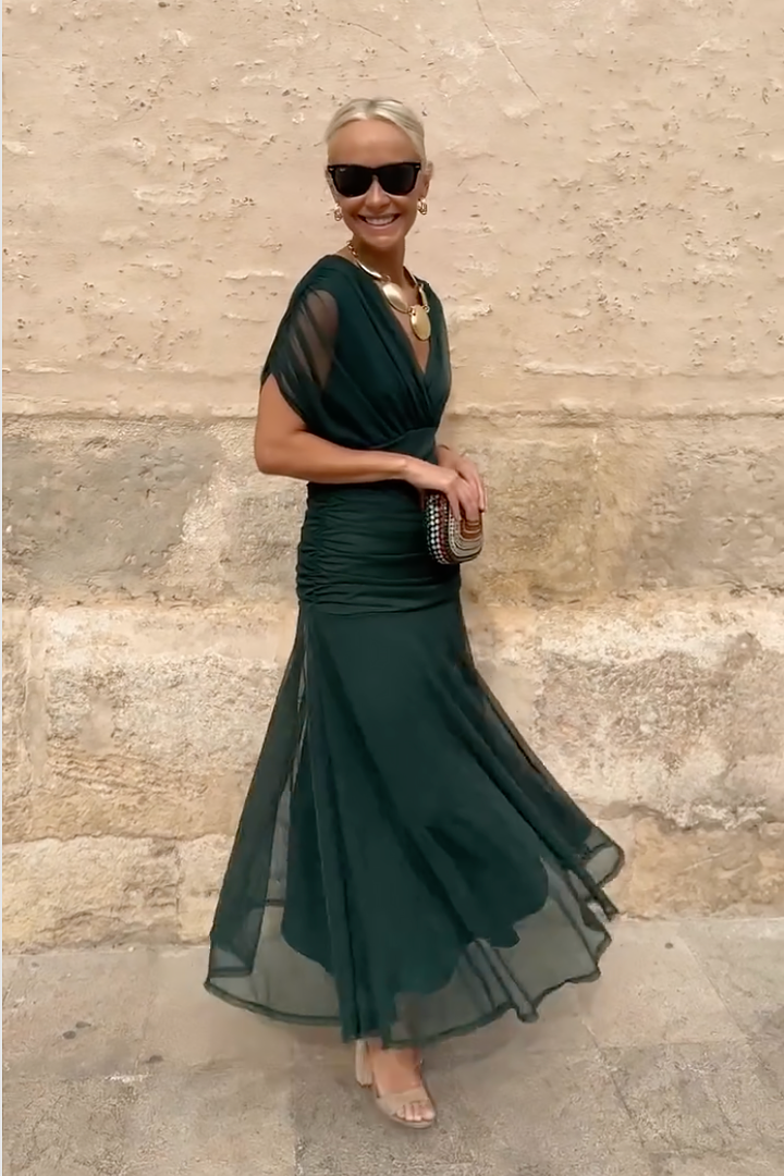 Woman wearing floral print V-neck maxi dress