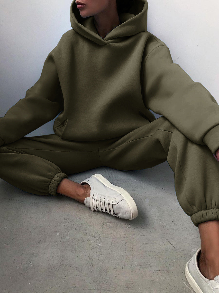 Woman wearing a hooded jogger set with elastic waist – army green