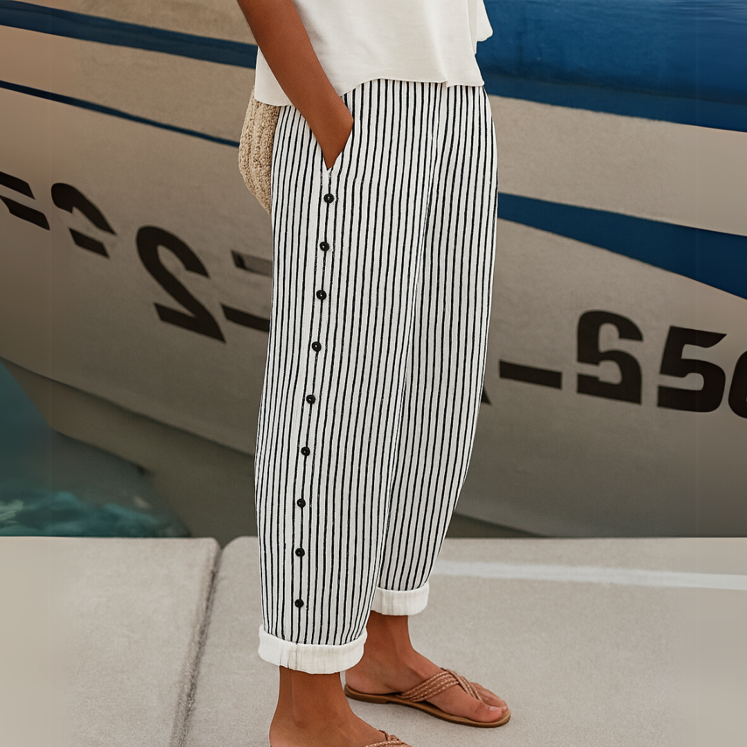 Woman wearing striped high-waisted button pants