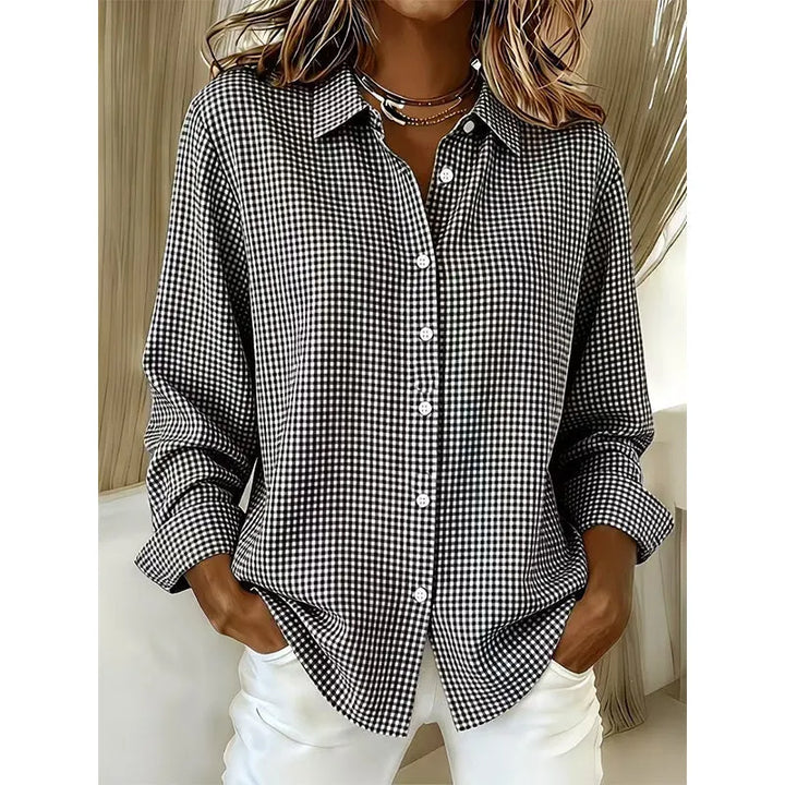 Woman wearing gingham button front long sleeve blouse