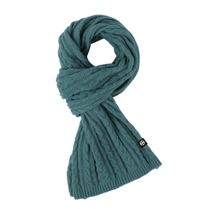 Woman wearing solid color long winter scarf outdoors