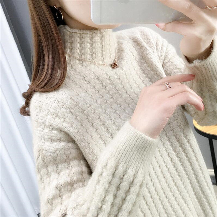 Women's cable knit turtleneck sweater front view