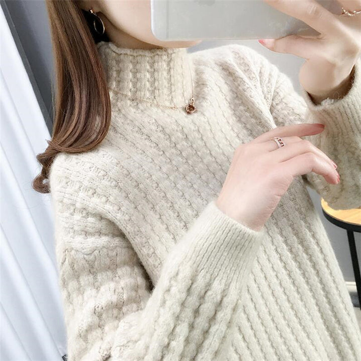 Women's cable knit turtleneck sweater front view