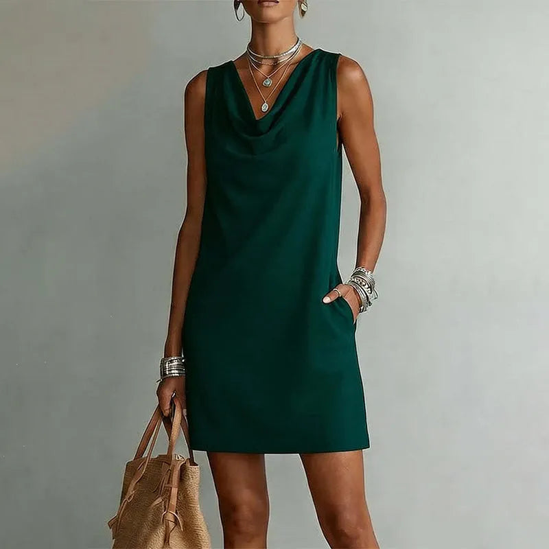Woman wearing sleeveless mini dress with draped neckline