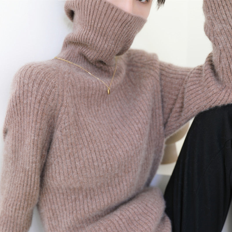Woman wearing loose knit fall sweater in neutral color