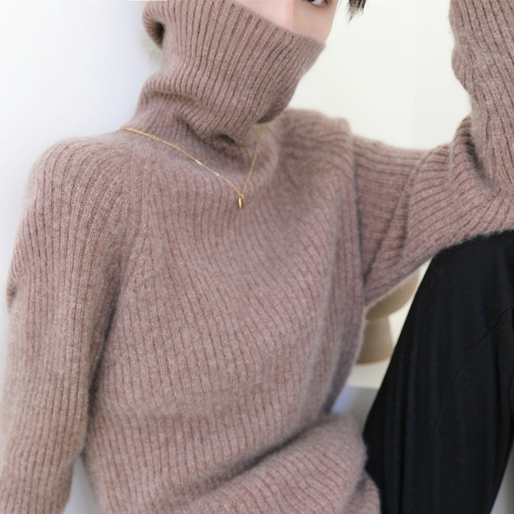 Woman wearing loose knit fall sweater in neutral color
