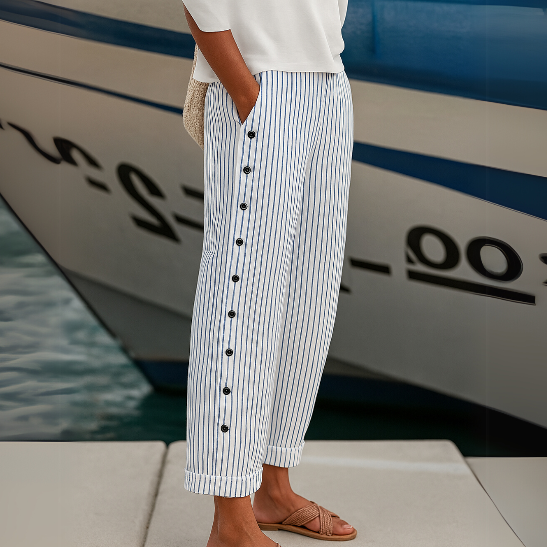 Woman wearing striped high-waisted button pants