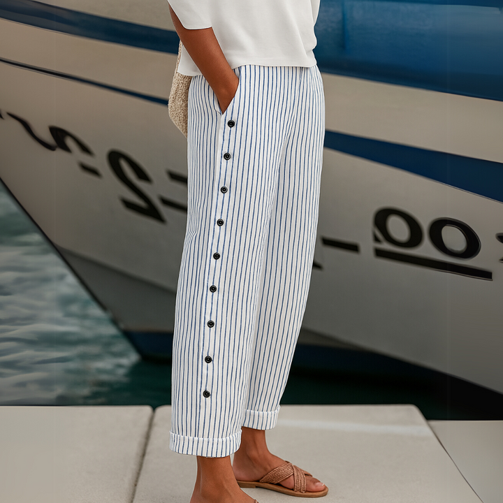 Woman wearing striped high-waisted button pants
