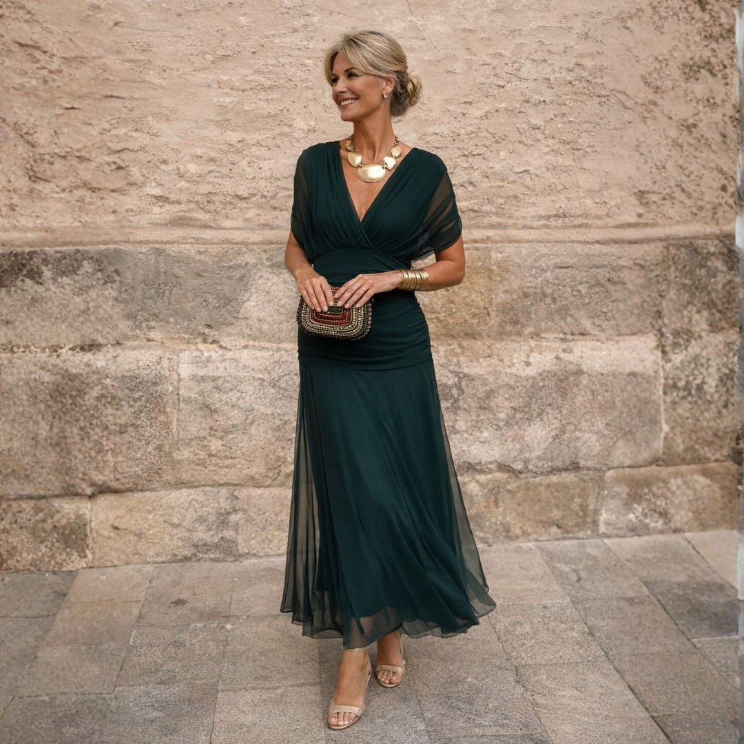 Woman wearing draped maxi dress with V-neck
