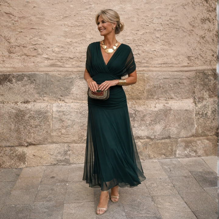 Woman wearing long maxi dress with crossover V-neck