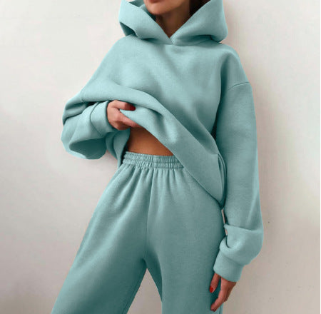 Woman wearing a hooded jogger set with elastic waist – light green