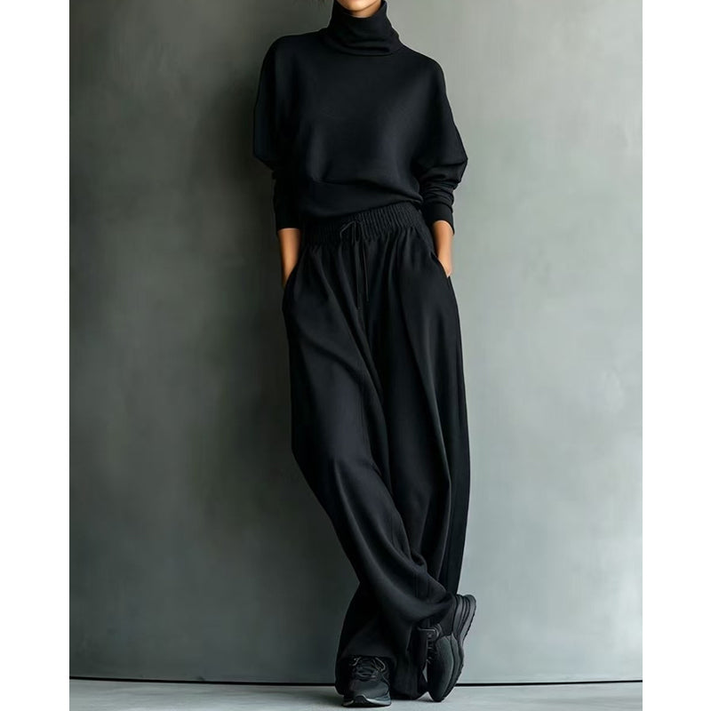 Woman wearing turtleneck two piece set with wide-leg pants