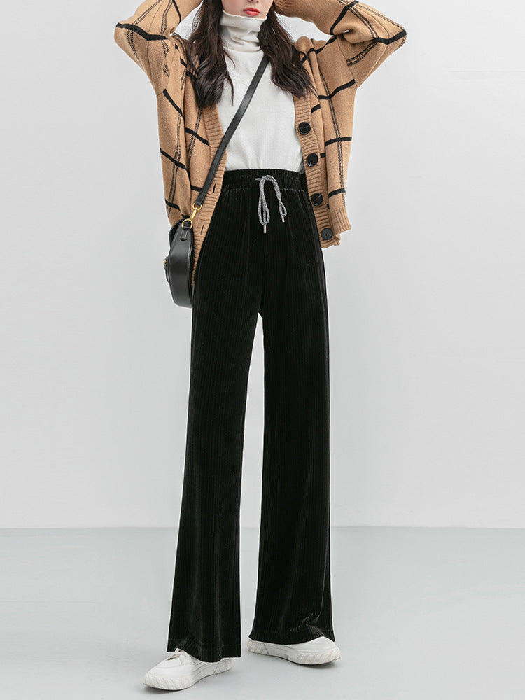 Woman wearing high waist corduroy wide leg pants