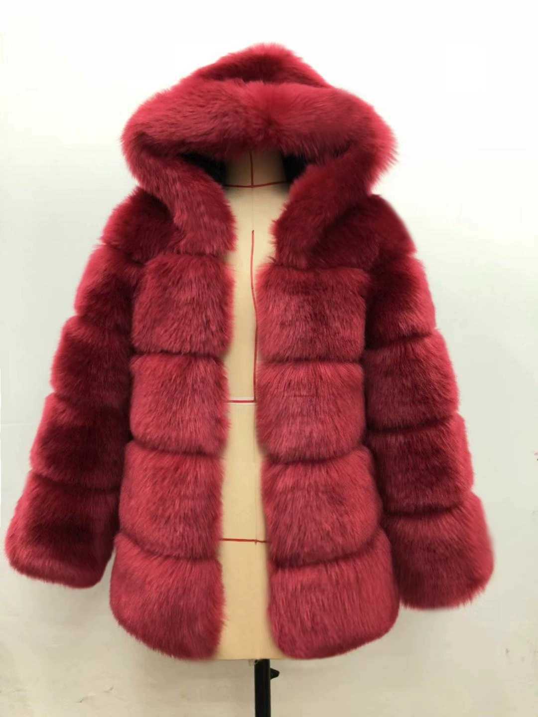 Woman wearing a faux fur winter coat with fur collar
