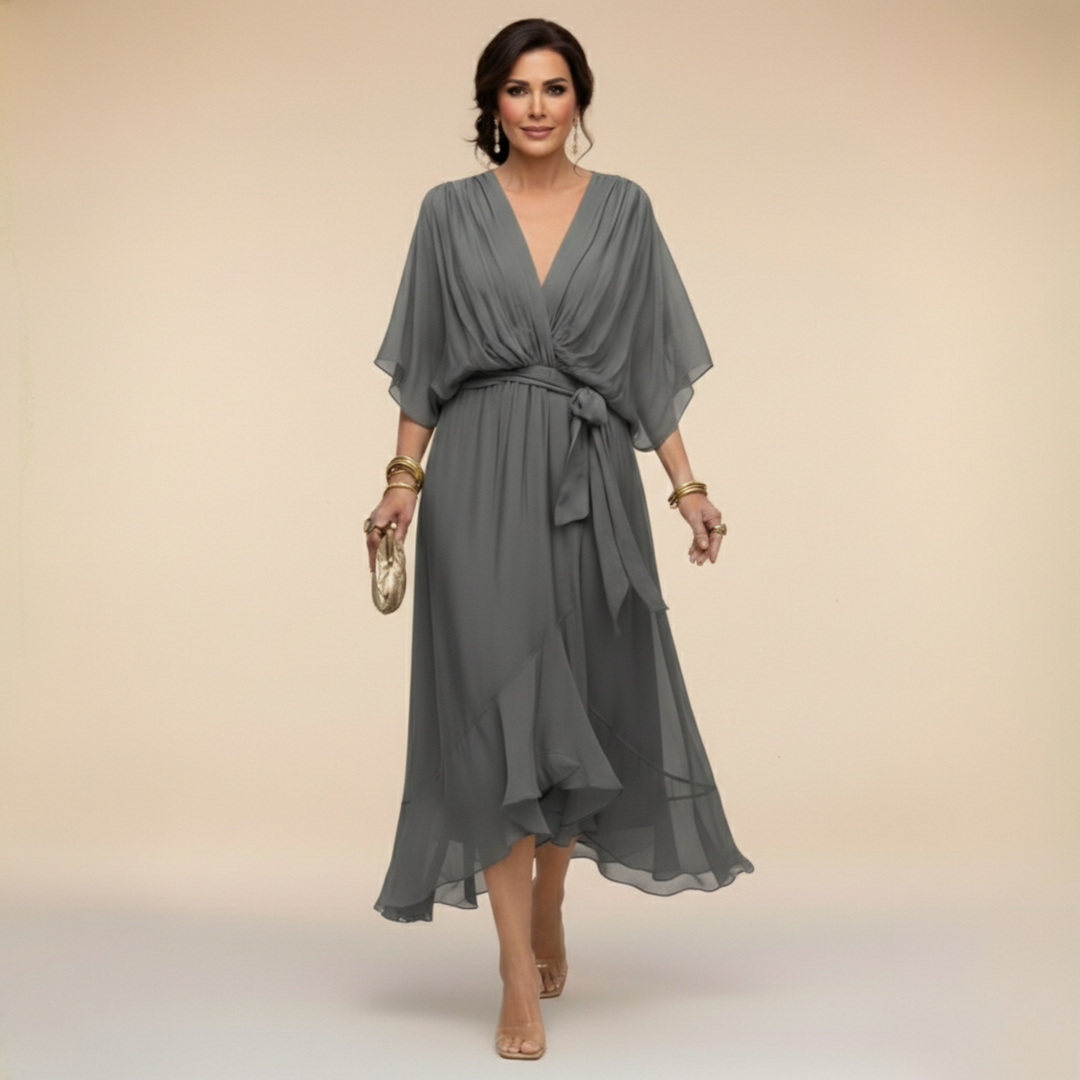 Woman wearing flowy V-neck dress outdoors