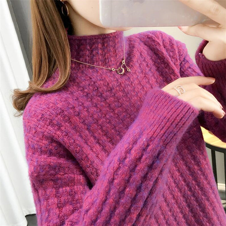 Women's cable knit turtleneck sweater front view