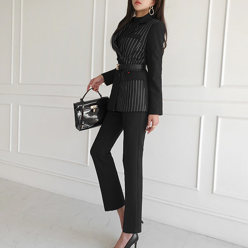 Woman wearing black striped blazer and slim pants set