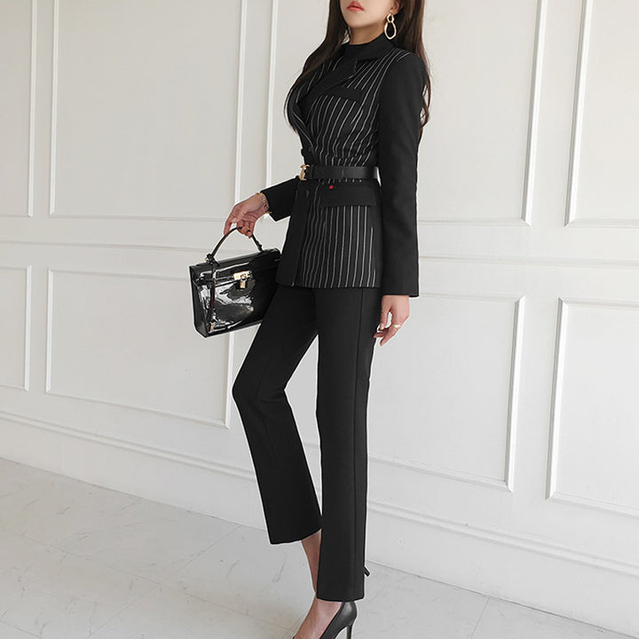 Woman wearing black striped blazer and slim pants set