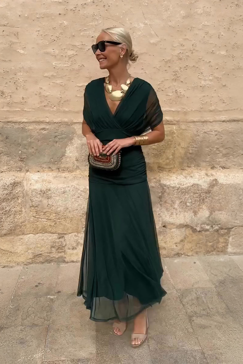 Woman wearing floral print V-neck maxi dress