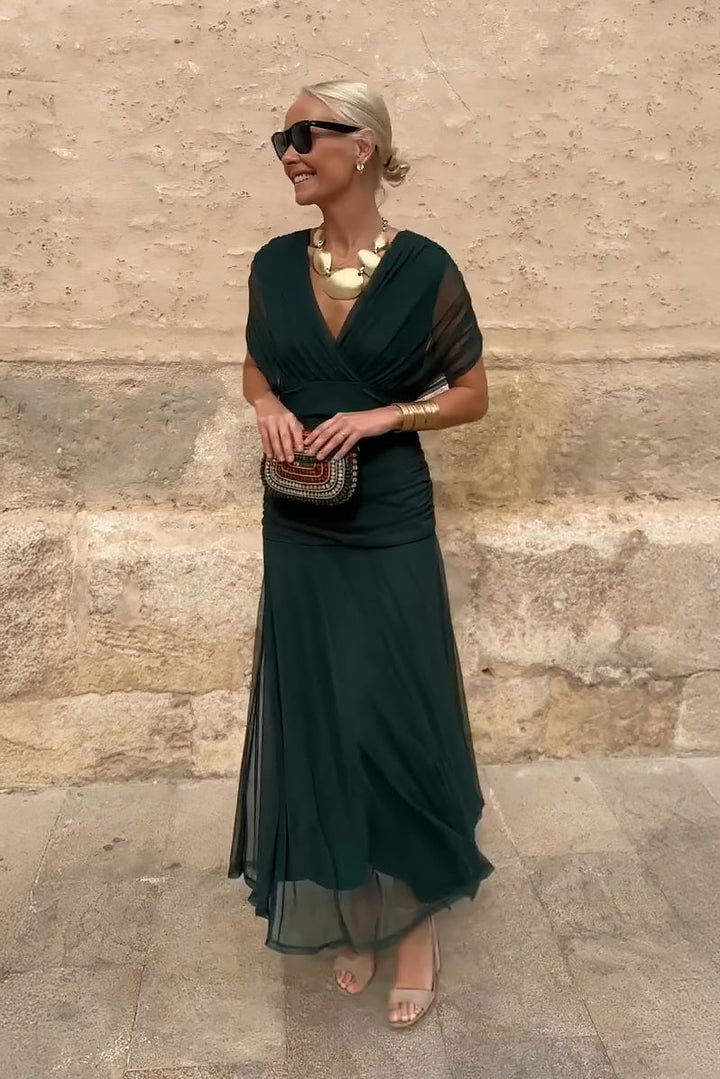 Woman wearing floral print V-neck maxi dress