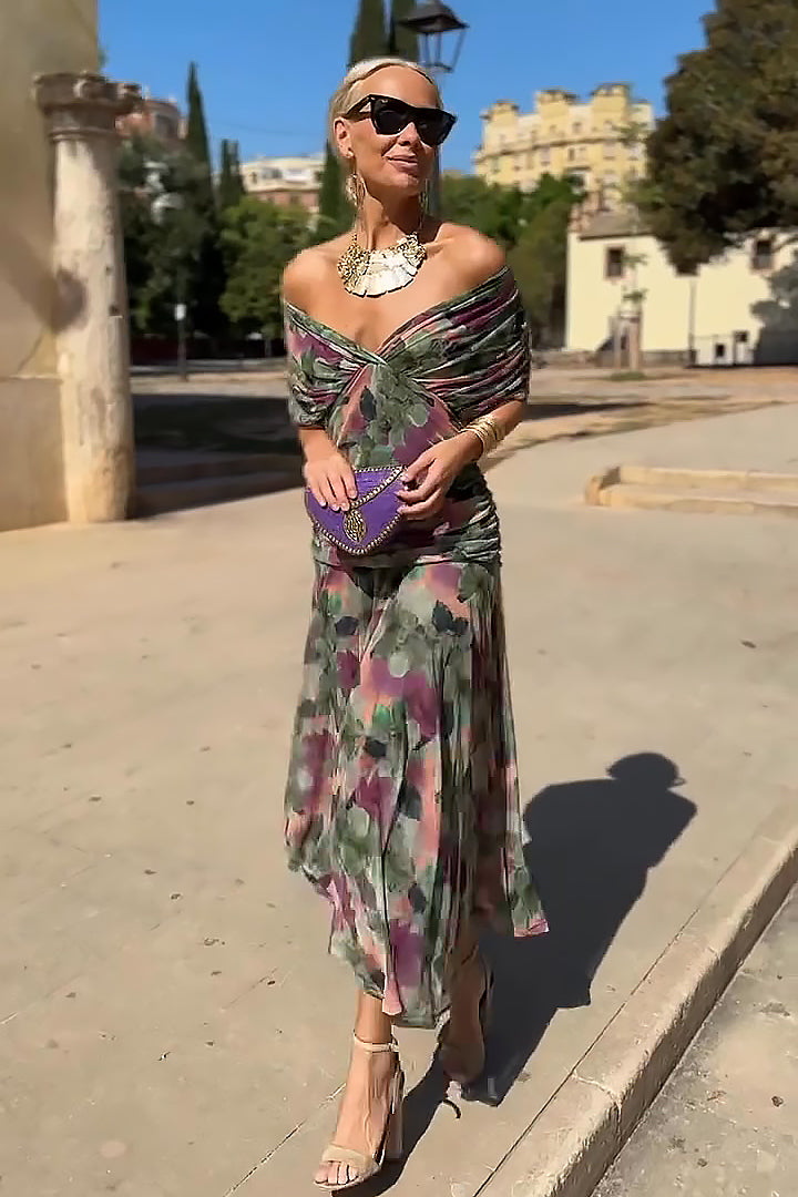 Woman wearing floral print V-neck maxi dress