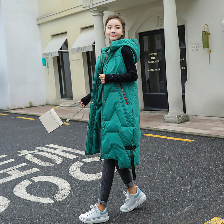 Women's long hooded puffer vest with zip closure