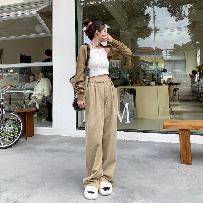 Woman wearing high waist wide leg pants in black