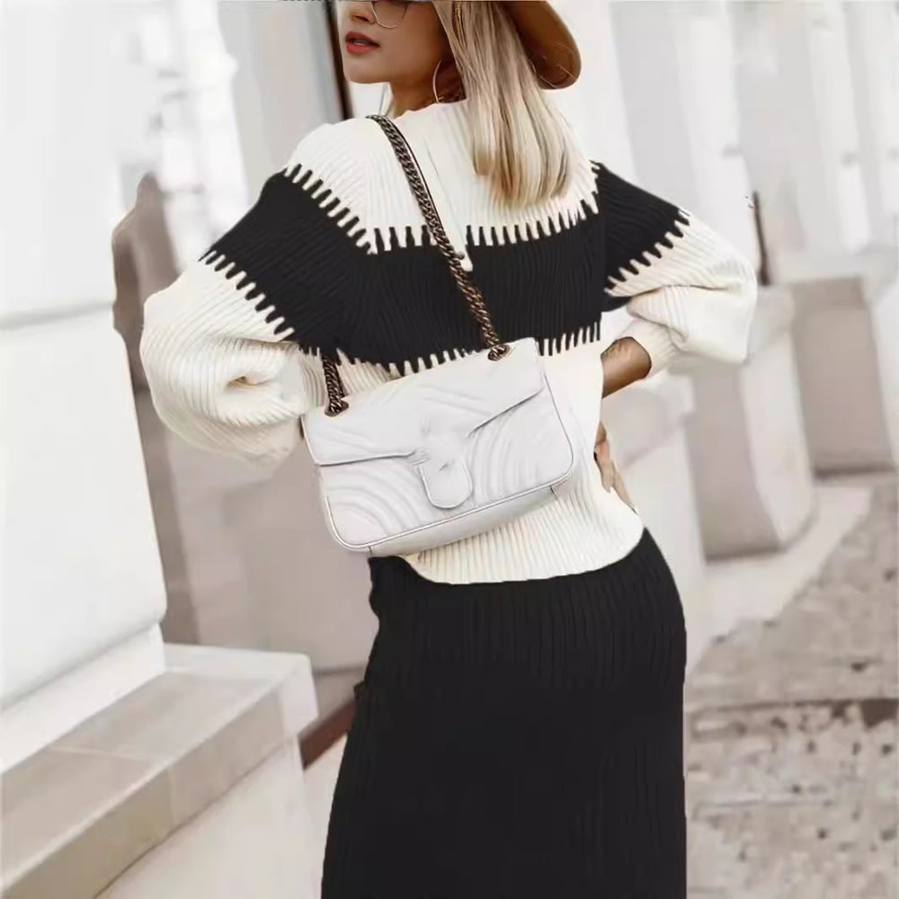 Woman wearing black knit sweater and skirt set