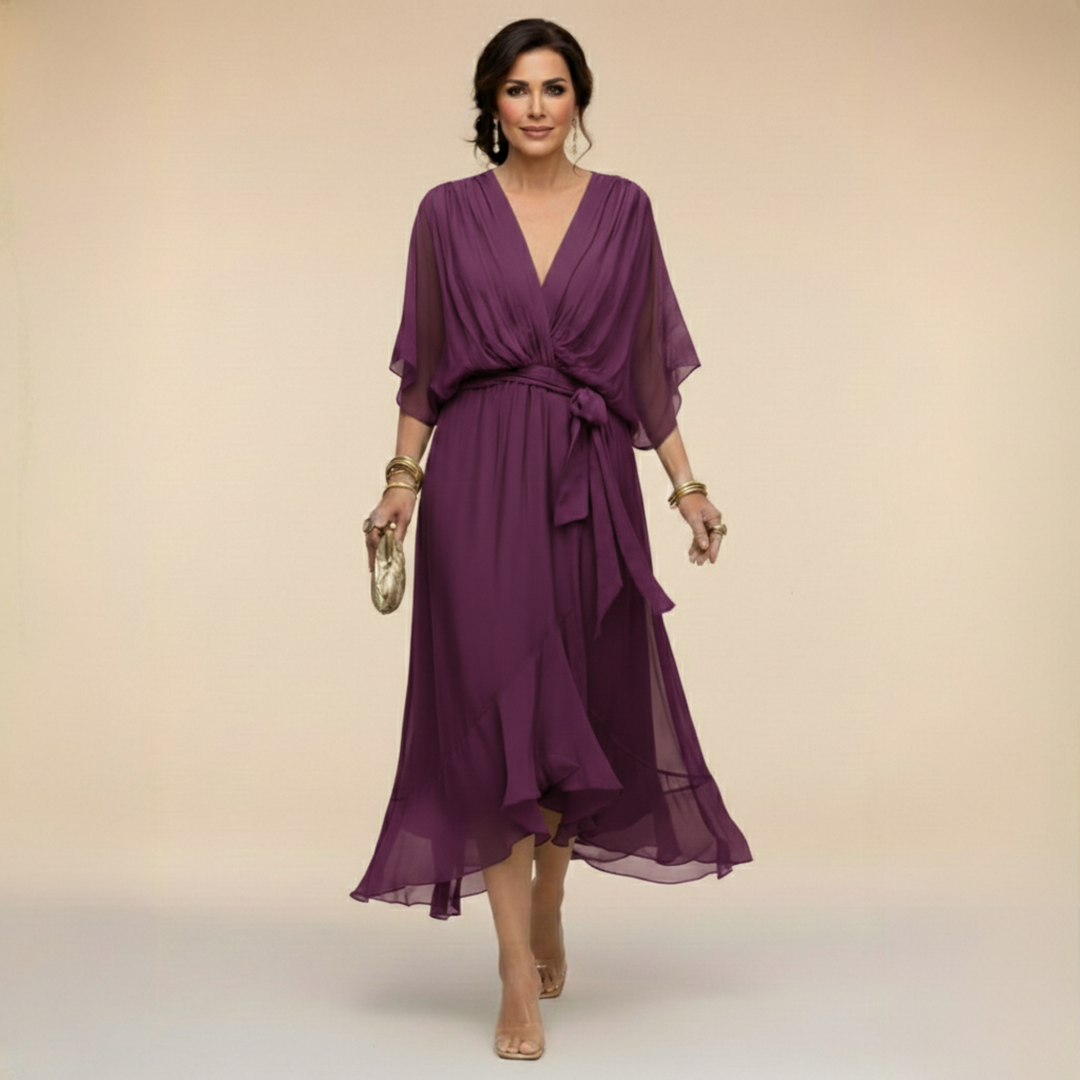 Woman wearing flowy V-neck dress outdoors