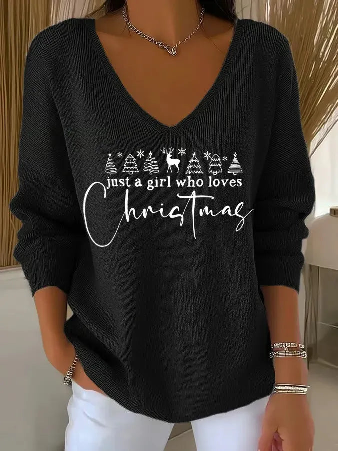 Woman wearing festive V-neck Christmas sweater with holiday print