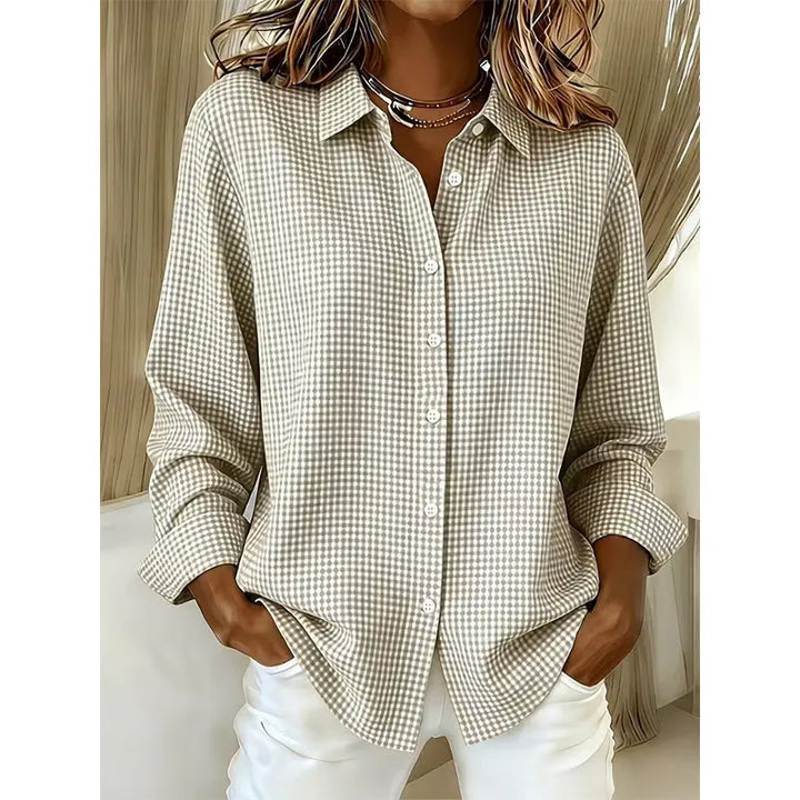 Woman wearing gingham button front long sleeve blouse
