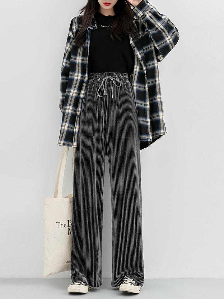 Woman wearing high waist corduroy wide leg pants