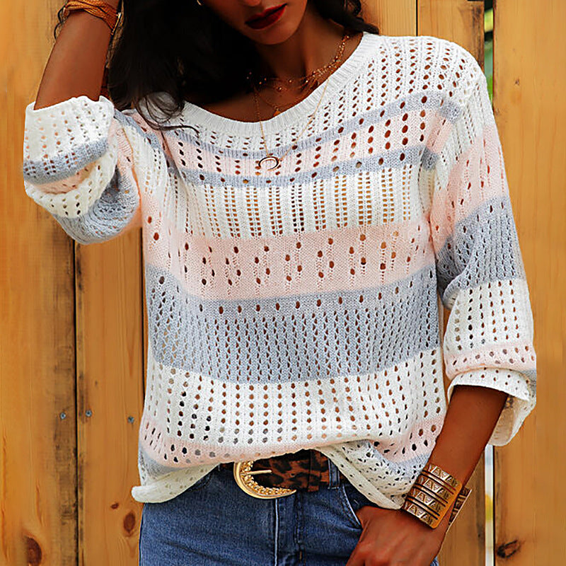 Pink loose striped knit sweater on model